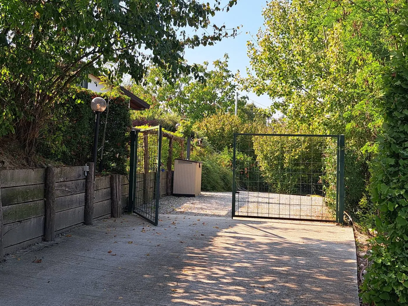 Fenced parking space with gate inside the Ciabot di Rosa property